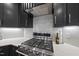 Modern kitchen with stainless steel range and hood at 9100 Dansforeshire Way, Wake Forest, NC 27587