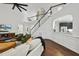 Cozy living room featuring a high ceiling, staircase, and views into the kitchen at 9100 Dansforeshire Way, Wake Forest, NC 27587