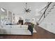 Bright living room with cathedral ceilings, fireplace, large sectional, and black staircase at 9100 Dansforeshire Way, Wake Forest, NC 27587