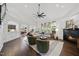 Bright living room with fireplace, hardwood floors, and plenty of natural light at 9100 Dansforeshire Way, Wake Forest, NC 27587