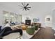 Bright living room with fireplace, hardwood floors, and lots of natural light at 9100 Dansforeshire Way, Wake Forest, NC 27587