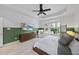 Spacious main bedroom with a sitting area by the window and hardwood furniture at 9100 Dansforeshire Way, Wake Forest, NC 27587