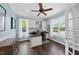 Bright office space with natural light, built-in shelving, and wood flooring at 9100 Dansforeshire Way, Wake Forest, NC 27587