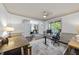 Spacious home office with hardwood floors, large windows, and neutral paint, perfect for working remotely at 9100 Dansforeshire Way, Wake Forest, NC 27587
