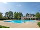 Large community pool and clubhouse offering an inviting recreational space at 9100 Dansforeshire Way, Wake Forest, NC 27587