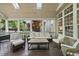 Comfortable screened porch with lounge furniture, ideal for relaxation and enjoying the outdoors at 9100 Dansforeshire Way, Wake Forest, NC 27587