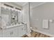 Bathroom with double sink, quartz countertop, and modern lighting fixtures at 1008 Holloway St, Durham, NC 27701