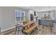 Bright dining area with a wooden table and bench seating, perfect for Gathering meals and entertaining guests at 1008 Holloway St, Durham, NC 27701