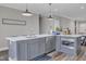 Kitchen island featuring stainless steel appliances and sink with pendant lighting and open view at 1008 Holloway St, Durham, NC 27701