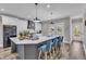 Spacious kitchen with island, stainless steel appliances, and seamless transition to dining space at 1008 Holloway St, Durham, NC 27701