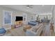 Inviting open-concept living room with lots of natural light, modern decor, and an adjacent dining area at 1008 Holloway St, Durham, NC 27701