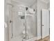 Modern shower with tiled walls, glass door, and bench at 1008 Holloway St, Durham, NC 27701