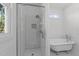 This bathroom features a glass enclosed shower, soaking tub, subway tile and a window providing natural light at 1011 Parker St, Raleigh, NC 27607