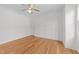 Bright bedroom features a ceiling fan, multiple closets, and large window offering natural light at 1011 Parker St, Raleigh, NC 27607