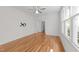 Spacious bedroom featuring hardwood floors, a ceiling fan, and lots of natural light at 1011 Parker St, Raleigh, NC 27607