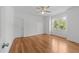 Bright bedroom features a ceiling fan, multiple closets, and large window offering natural light at 1011 Parker St, Raleigh, NC 27607