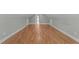 Spacious bonus room with hardwood floors, neutral paint, and natural light from windows at 1011 Parker St, Raleigh, NC 27607