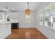 Bright dining area featuring hardwood floors, a modern light fixture and plenty of natural light at 1011 Parker St, Raleigh, NC 27607