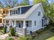 Charming home exterior featuring a classic front porch and a well-maintained garden at 1011 Parker St, Raleigh, NC 27607