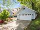 Detached garage with white door and landscaping at 1011 Parker St, Raleigh, NC 27607