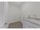 This laundry room offers tile flooring, a utility sink and lots of space at 1011 Parker St, Raleigh, NC 27607