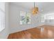 Bright living room with hardwood floors and large windows providing plenty of natural light at 1011 Parker St, Raleigh, NC 27607