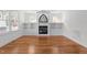 Spacious living room showcasing a fireplace, built-in shelving, and hardwood floors at 1011 Parker St, Raleigh, NC 27607