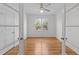 Bright office space featuring hardwood floors, a ceiling fan, and natural light at 1011 Parker St, Raleigh, NC 27607