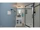 Bathroom features blue vanity sink, glass shower and blue walls at 1015 Washington St, Burlington, NC 27217