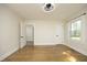 Bedroom with hardwood floors and two doorways at 1015 Washington St, Burlington, NC 27217