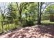 Large wooden deck with railing overlooking the expansive backyard and mature trees at 1015 Washington St, Burlington, NC 27217