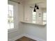 Dining area with a sleek breakfast bar and modern pendant lighting at 1015 Washington St, Burlington, NC 27217