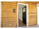 Inviting front door with sidelight, set in a warm, wood-paneled exterior, offering a welcoming entrance at 1015 Washington St, Burlington, NC 27217