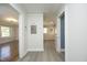 Hallway with light wood-look floors leads to multiple rooms at 1015 Washington St, Burlington, NC 27217