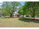 Charming home with mature trees and a lush green lawn; curb appeal at its finest at 1017 Southerlund Rd, Garner, NC 27529