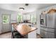 Well-equipped kitchen with white cabinets and butcher block countertops at 1017 Southerlund Rd, Garner, NC 27529