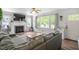Bright living room featuring a fireplace, large windows and cozy seating area at 1017 Southerlund Rd, Garner, NC 27529