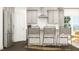 Elegant kitchen island featuring stylish seating and stainless steel appliances at 1020 Aspen View Dr, Raleigh, NC 27610