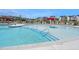 Community pool with zero entry and splash features, surrounded by lounge chairs and seating at 1020 Aspen View Dr, Raleigh, NC 27610