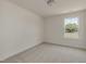 Bright bedroom with neutral carpet and a view of trees outside of the window at 1028 Channel Drop Lp, Zebulon, NC 27597