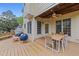Inviting back deck with outdoor seating, a ceiling fan, and a peaceful ambiance at 1053 Loop Rd, Clayton, NC 27527