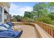 Cozy back deck with blue cushioned seating and a built-in bench for outdoor relaxation at 1053 Loop Rd, Clayton, NC 27527