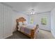 Charming bedroom with wallpaper design, ceiling fan, and natural light at 1053 Loop Rd, Clayton, NC 27527