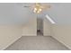 Cozy carpeted bedroom featuring a ceiling fan and natural light from a window at 1053 Loop Rd, Clayton, NC 27527