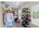 Walk-in closet with ample shelving, windows, and plenty of room for storage at 1053 Loop Rd, Clayton, NC 27527