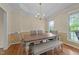 Charming dining room with hardwood floors, modern lighting, and ample natural light at 1053 Loop Rd, Clayton, NC 27527