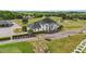 Elegant white clubhouse with lush landscaping and a sprawling golf course backdrop at 1053 Loop Rd, Clayton, NC 27527