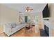Inviting living room with fireplace, ceiling fan and hardwood floors at 1053 Loop Rd, Clayton, NC 27527