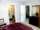 Spacious bedroom with access to the bathroom offering a view into the dining room at 1062 Washington St # 201, Raleigh, NC 27605
