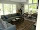 Comfortable living room featuring a large window, plush sofa, and accent chairs at 1062 Washington St # 201, Raleigh, NC 27605
